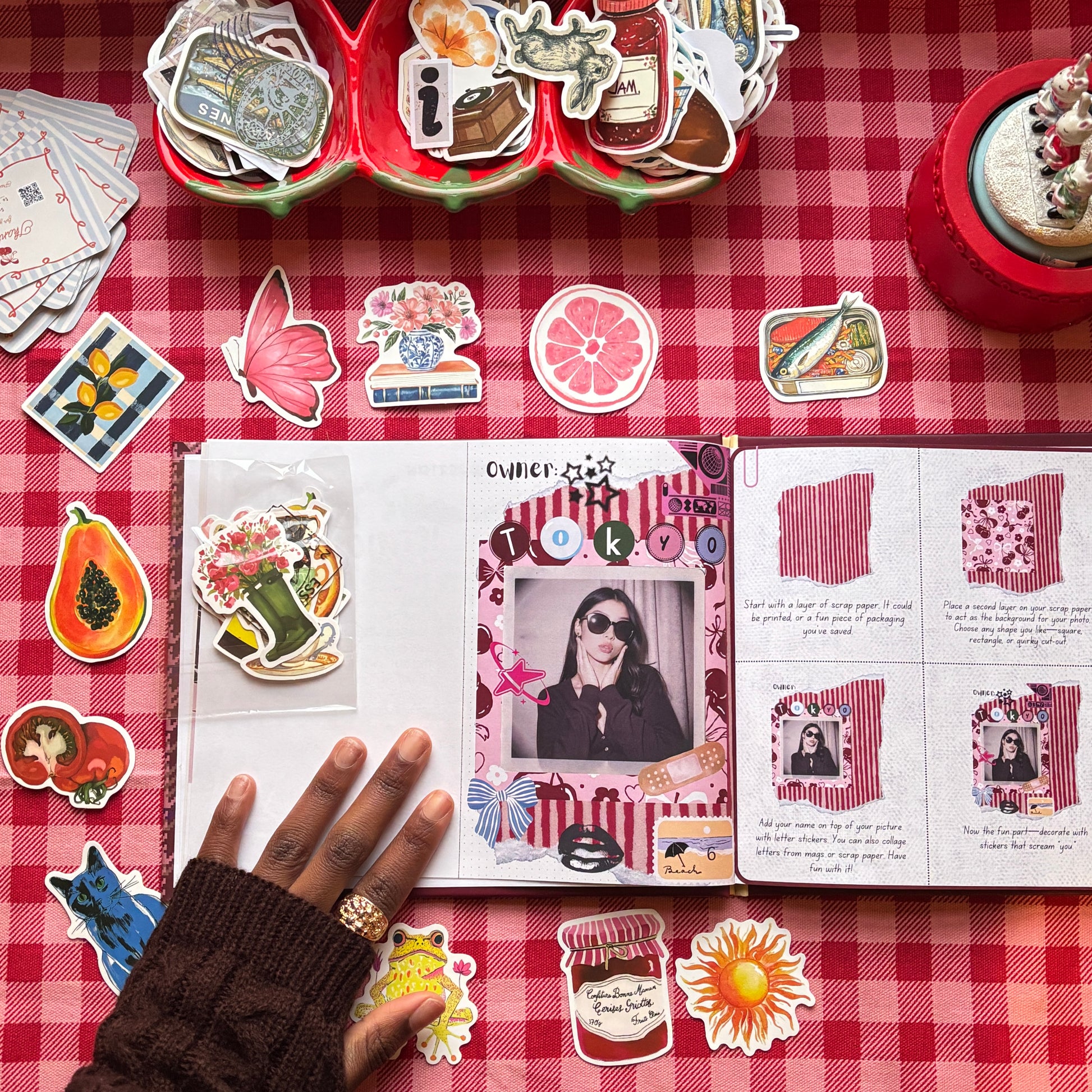 Personalized scrap journal owner page with photo, stickers, and layered collage elements styled on red gingham background